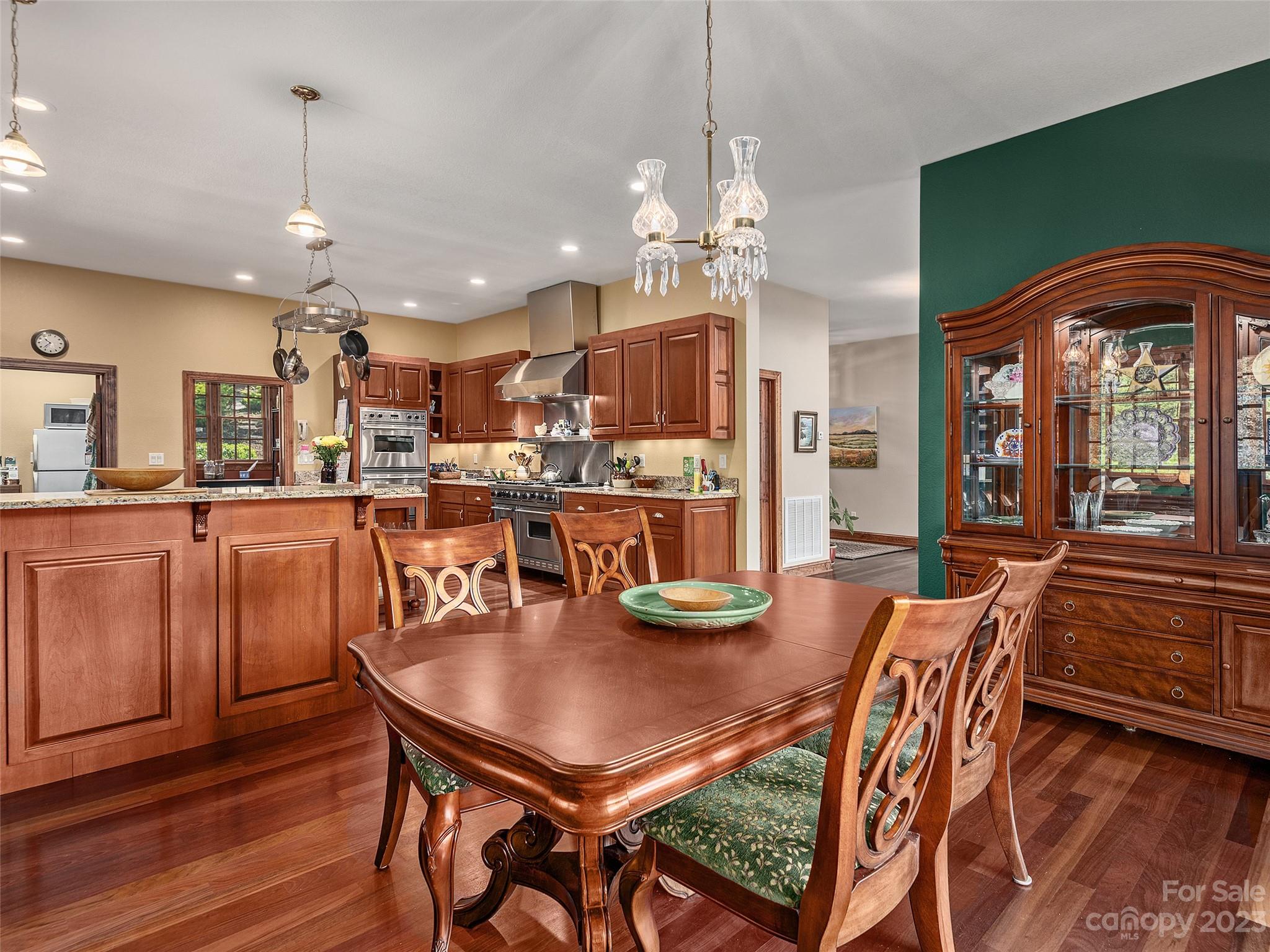 234 Arbor Ridge Clyde, NC 28721 - Photo 9 of 33 a view of a dining room with furniture window and wooden floor