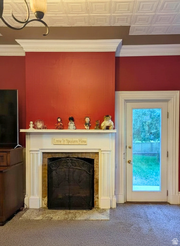 190 North 200 E Street Beaver, UT 84713 - Photo 23 of 40 Master bedroom Fireplace featuring a white mantel, brick surround, and decorative screen