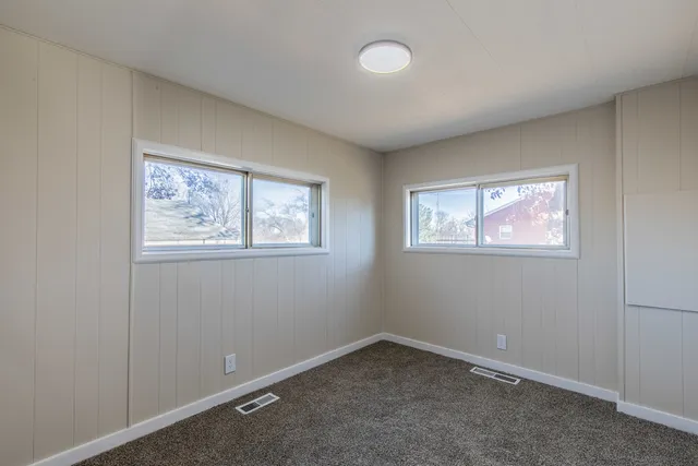 a view of empty room with windows