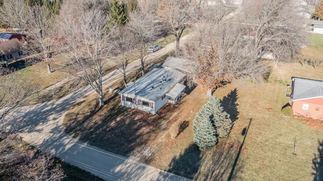 a aerial view of a house with a yard