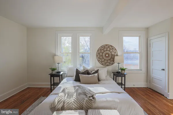 a bedroom with a bed and a table in it