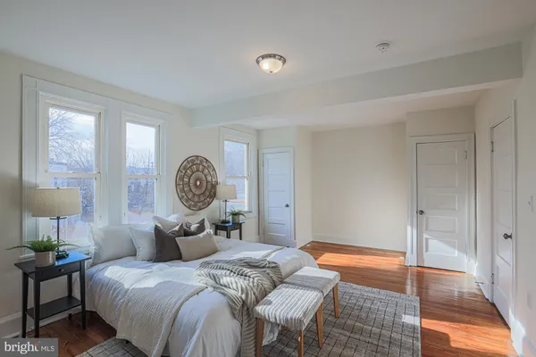 a bedroom with a bed and window