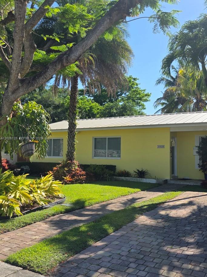 8040 Southwest 63rd Place Miami, FL 33143 - Photo 2 of 15 a view of a house with swimming pool in front of it