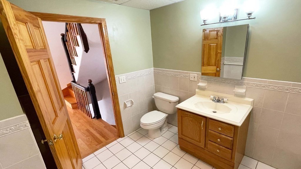 21 Parker Street Boston, MA 02129 - Photo 13 of 28 a bathroom with a sink a toilet and mirror