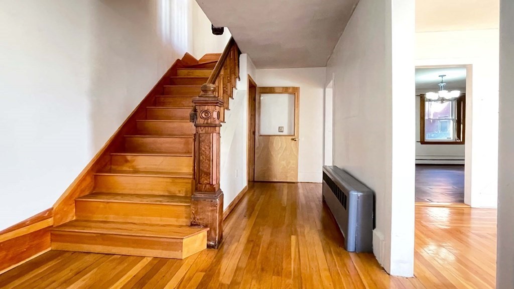 21 Parker Street Boston, MA 02129 - Photo 3 of 28 a view of entryway and hall with wooden floor