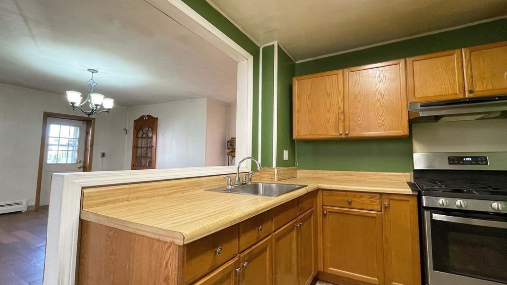 21 Parker Street Boston, MA 02129 - Photo 6 of 28 a kitchen with a sink stove and microwave