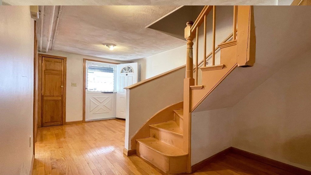 21 Parker Street Boston, MA 02129 - Photo 8 of 28 a view of entryway with wooden floor