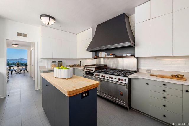 a kitchen with a stove and a sink