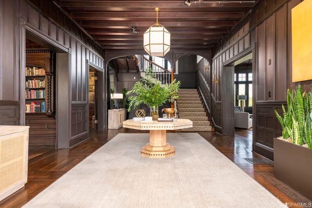 a view of hall way with furniture