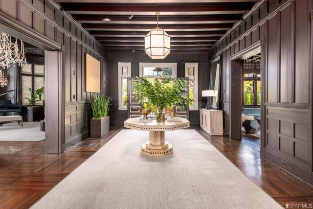 a lobby with furniture and a potted plant