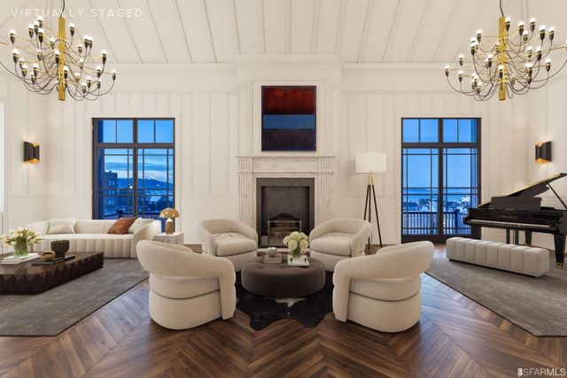 a living room with fireplace furniture and a wooden floor