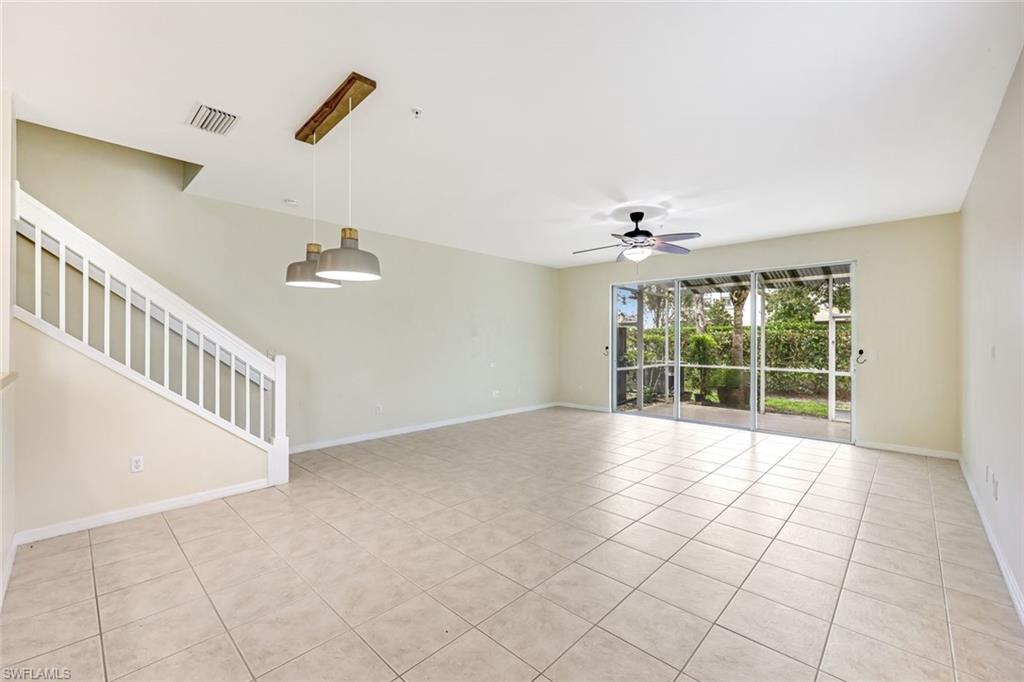 16162 Ravina Way, Unit 65 Naples, FL 34110 - Photo 4 of 22 a view of an empty room with a window