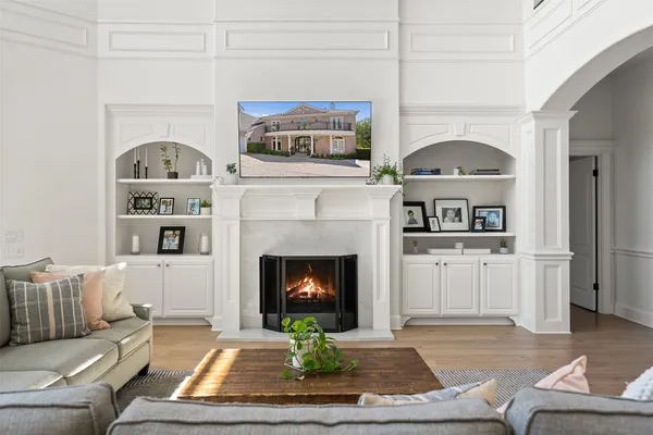 a living room with furniture and a fireplace