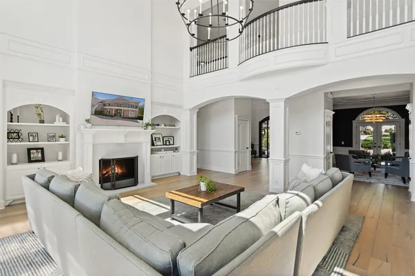 a living room with furniture fireplace and flat screen tv