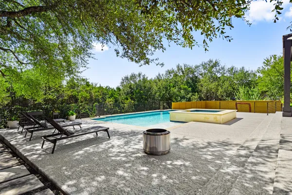a view of a swimming pool with a patio