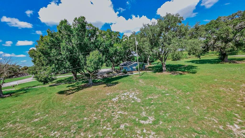 1030 Chalet Suzanne Road Lake Wales, FL 33859 - Photo 5 of 5 a view of a park with large trees