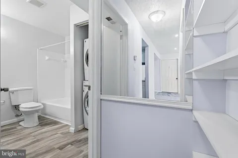 a view of a hallway with washer and dryer