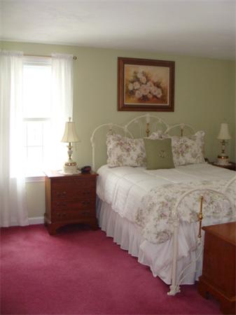4 Kerri Lane Whitman, MA 02382 - Photo 20 of 30 a bedroom with a bed and a window