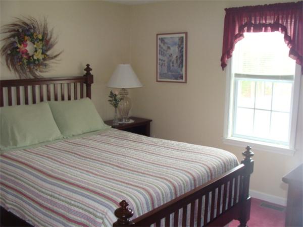 4 Kerri Lane Whitman, MA 02382 - Photo 24 of 30 a bedroom with a bed and a window