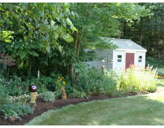 4 Kerri Lane Whitman, MA 02382 - Photo 3 of 30 a view of backyard with potted plants and a fountain