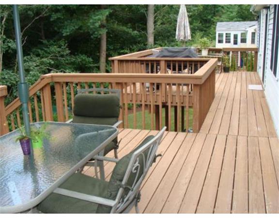 4 Kerri Lane Whitman, MA 02382 - Photo 4 of 30 a view of a roof deck with wooden floor and fence