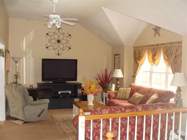 4 Kerri Lane Whitman, MA 02382 - Photo 5 of 30 a living room with furniture a large window and a flat screen tv