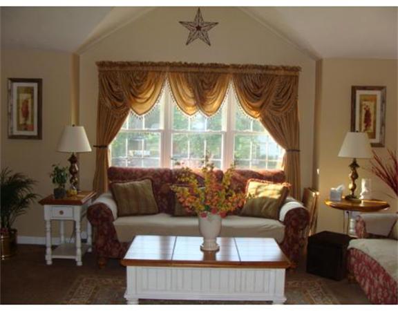 4 Kerri Lane Whitman, MA 02382 - Photo 6 of 30 a living room with furniture and a large window