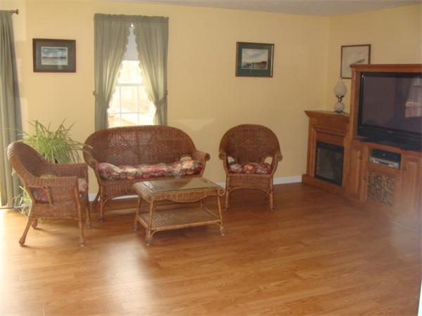4 Kerri Lane Whitman, MA 02382 - Photo 10 of 30 a living room with furniture and a flat screen tv