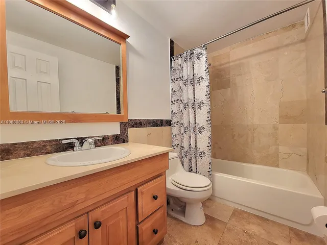 a bathroom with a sink a toilet and a bathtub