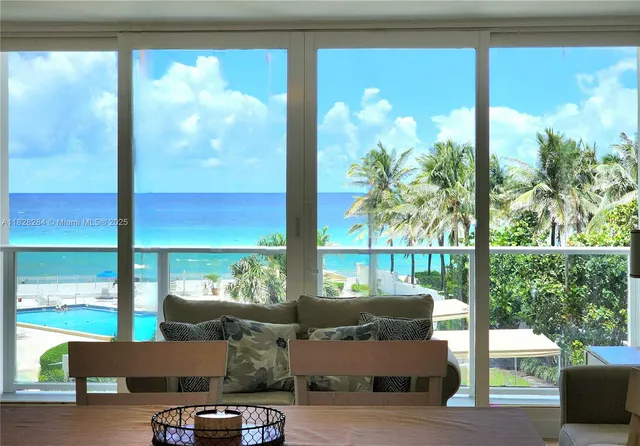 a living room with large windows