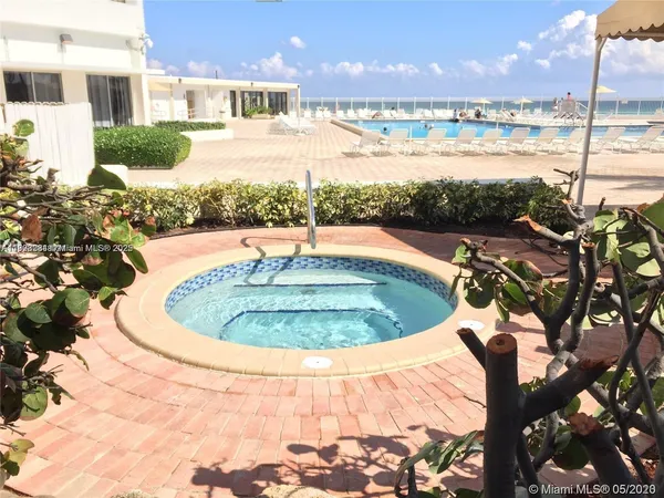 a view of a swimming pool with a lake view