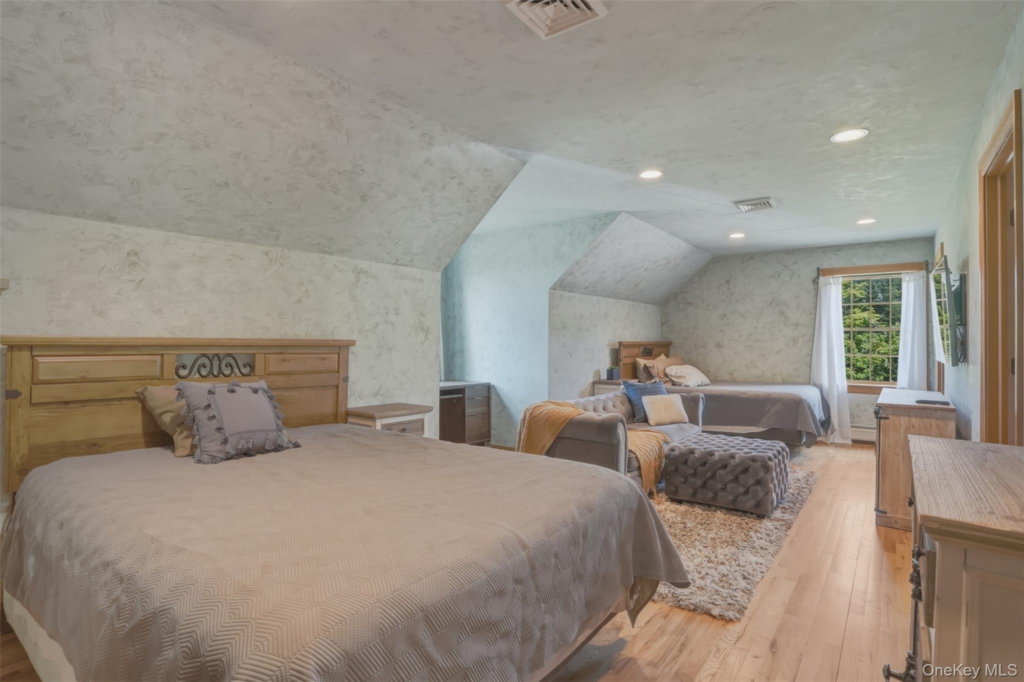 95 Judson Road Montgomery, NY 12549 - Photo 24 of 50 Upstairs, two generously sized bedrooms share a full bath, while a peaceful loft-style sitting area overlooks both the great room below and the picturesque grounds beyond.
