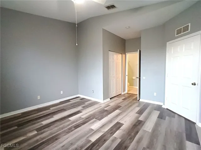 a view of room with window and hardwood floor