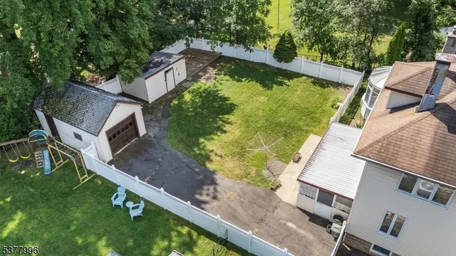an aerial view of house with yard