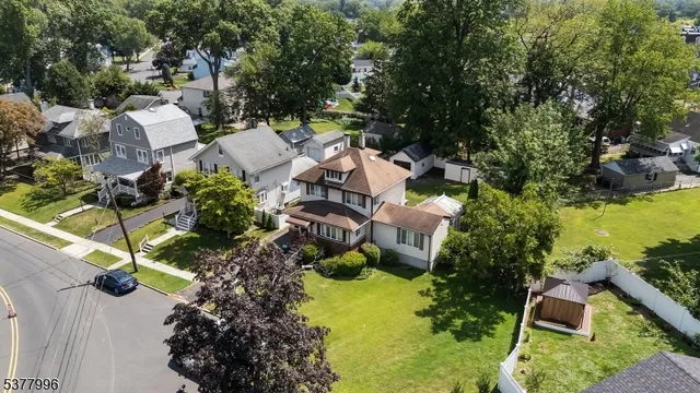an aerial view of a house with yard swimming pool and outdoor seating