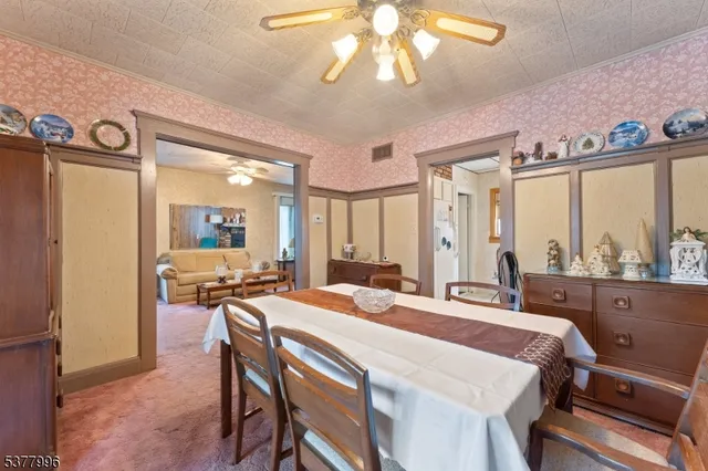 a large kitchen with a table and chairs