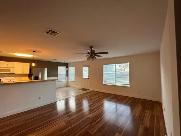 a view of a kitchen with a sink and a window