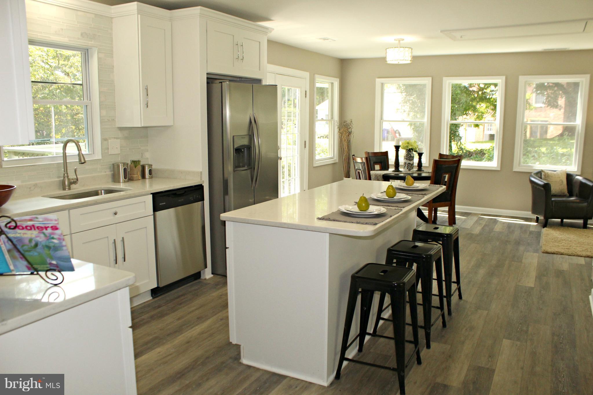 6104 Sam Riggs Road Laytonsville, MD 20882 - Photo 4 of 29 New kitchen with quartz and luxury vinyl plank!
