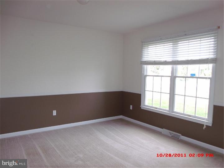 793 East Pebworth Road Magnolia, DE 19962 - Photo 2 of 12 an empty room with a window
