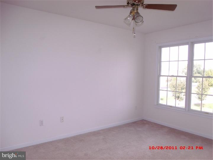 793 East Pebworth Road Magnolia, DE 19962 - Photo 11 of 12 an empty room with a window