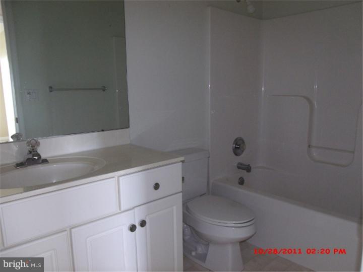 793 East Pebworth Road Magnolia, DE 19962 - Photo 10 of 12 a bathroom with a sink a toilet and shower