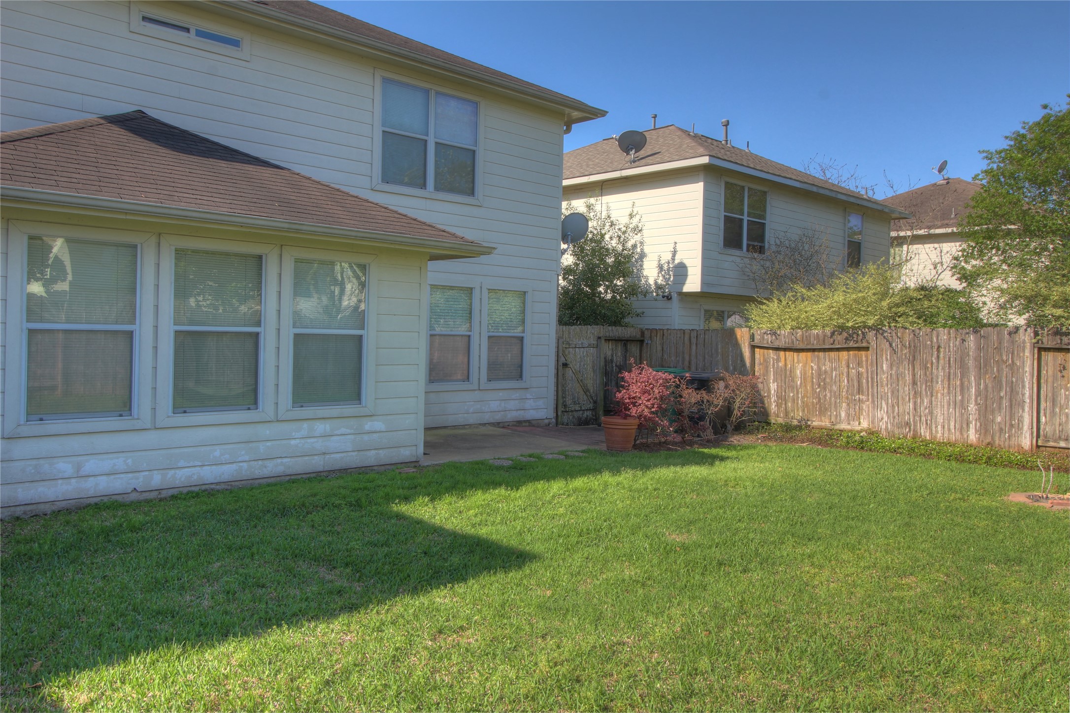 5530 Violet Path Lane Houston, TX 77085 - Photo 16 of 17 a view of a house with a backyard