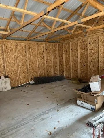 a view of a room with wooden walls