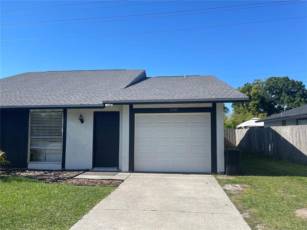 a house with yard in front of it