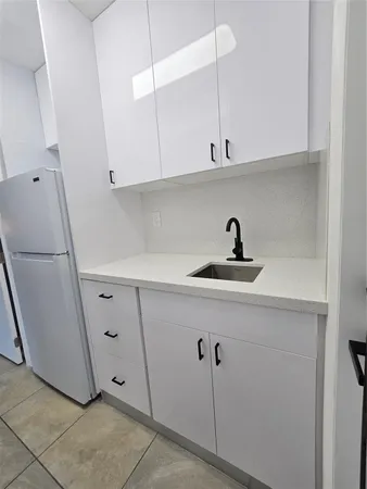 a view of kitchen and utility room