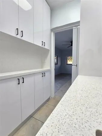 a bathroom with a sink a toilet and a shower