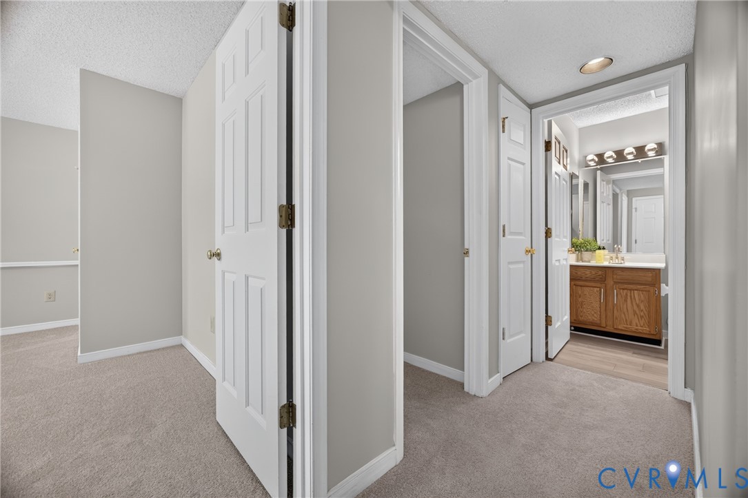 1559 Tree Ridge Road Henrico, VA 23231 - Photo 30 of 40 Plush carpeted hallway with light gray wall paint
