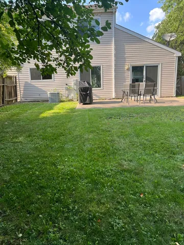 a front view of house with yard and seating area