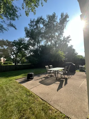 a view of outdoor space with garden and trees
