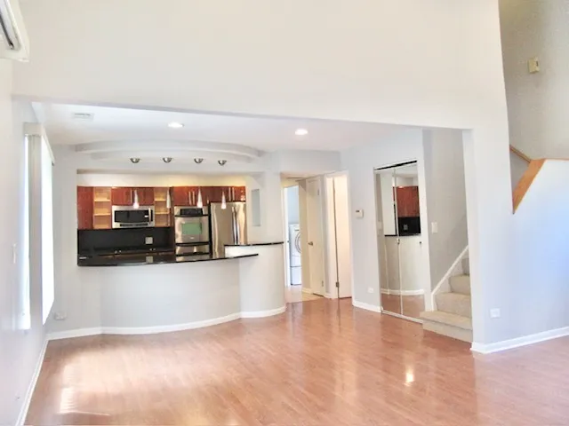 a view of a living room with kitchen island